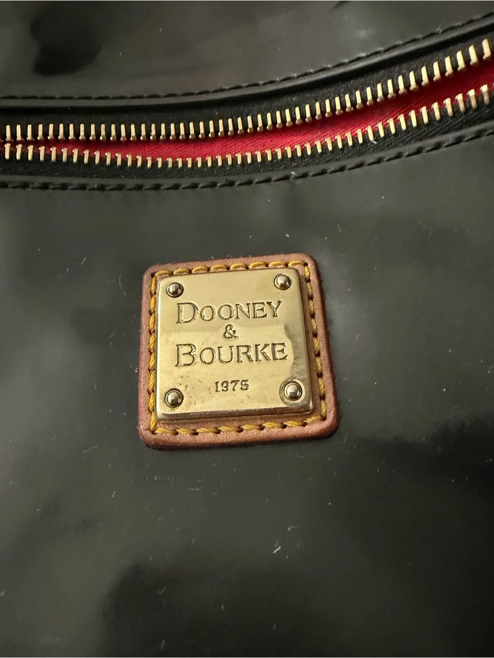 Dooney & Bourke Black Patent Shoulder Bag with Tan Trim and Red Lining